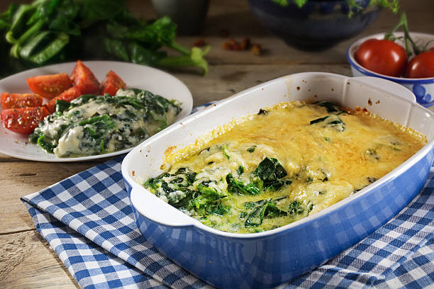 istock baked spinach with cheese in the baking dish and ingredients 513799188
