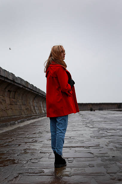 istock Young woman on an old pier 513799304