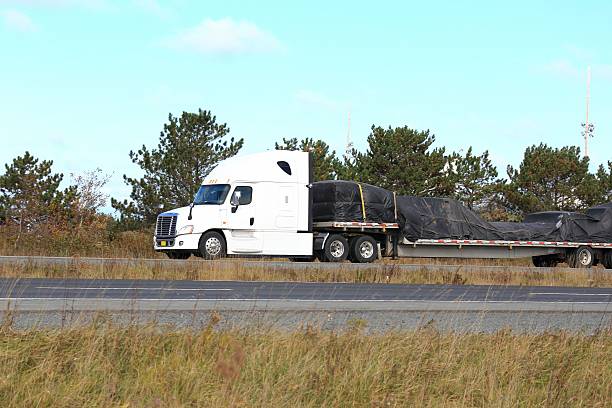 istock Semi truck and trailer on a highway 513800468