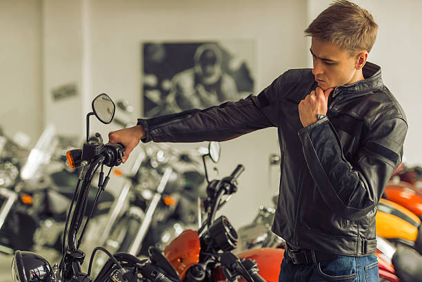 istock Man with motorbike 513804126