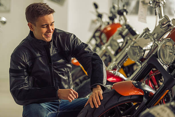 istock Man with motorbike 513804740