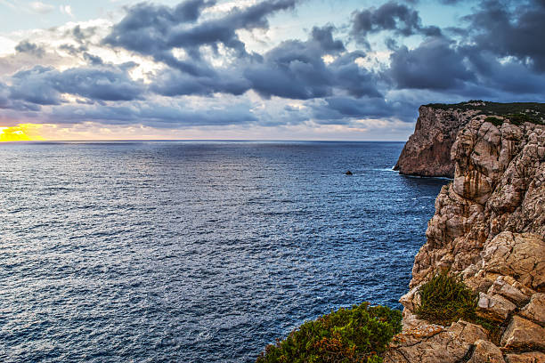 istock cloudy sky over Capo Caccia coastline 513807498