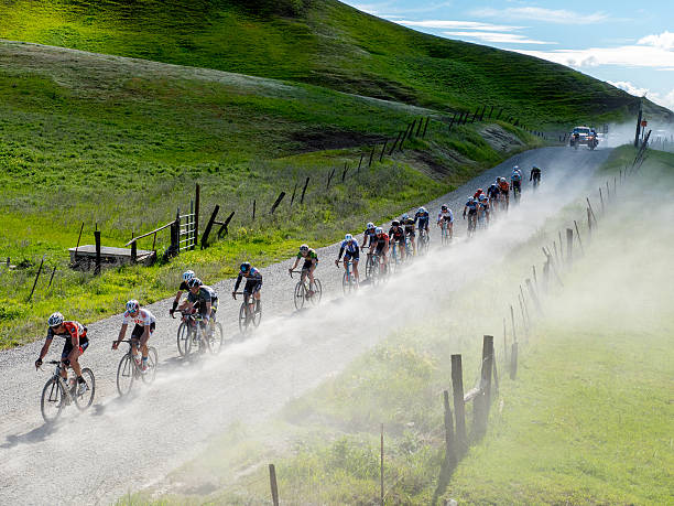 Professional cyclists racing in Northern California foothills Chico, California, USA - February 28, 2015: Pro/1/2 Category peloton during the road race stage at the Chico Stage Race in Northern California. chico california photos stock pictures, royalty-free photos & images