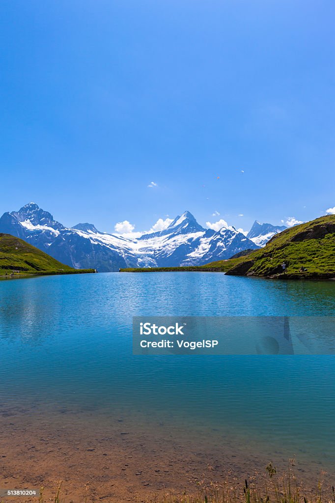 Stunning view of Bachalpsee and the alps Stunning view of Bachalpsee and the snow coverd peaks with glacier of swiss alps, on Bernese Oberland, Switzerland. Backgrounds Stock Photo