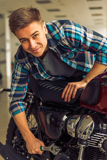 istock Man with motorbike 513811690