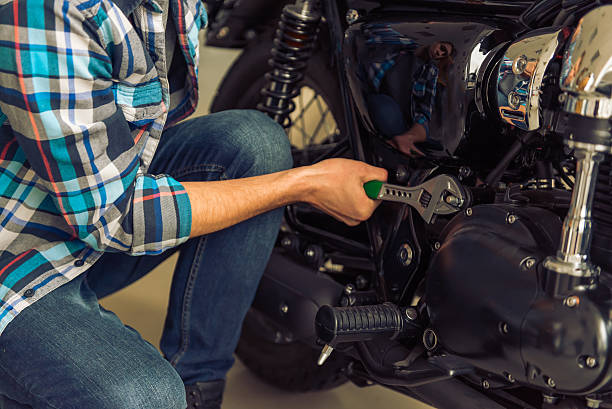 istock Man with motorbike 513811856