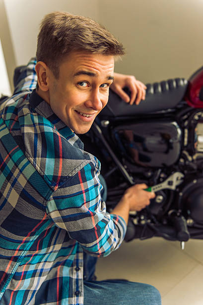 istock Man with motorbike 513811946