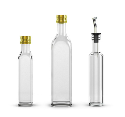 empty glass bottles for olive oil of different sizes isolated on white background
