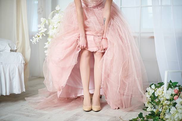 istock Bride in a pink dress with flowers 513814266