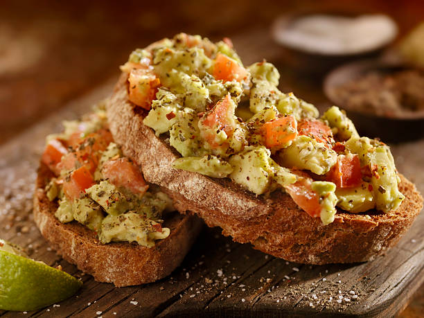 Avocado Toast with Tomatoes on Rye Bread