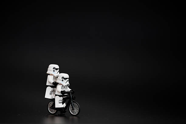 Orvieto, Italy - November 20th 2015: Star Wars Lego Stormtroopers minifigures on bicycle. Lego is a popular line of construction toys manufactured by the Lego Group