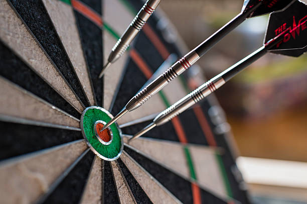 istock Darts sticking in a dartboard 513817968