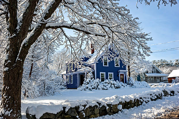 House at Christmas time with candles in windows and wreath on door