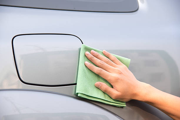 istock Cleaning car with green microfiber cloth 513819932