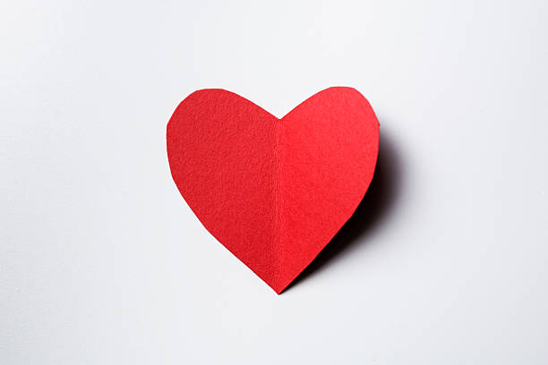 istock Red paper in heart shape on white background with shadow 513819976