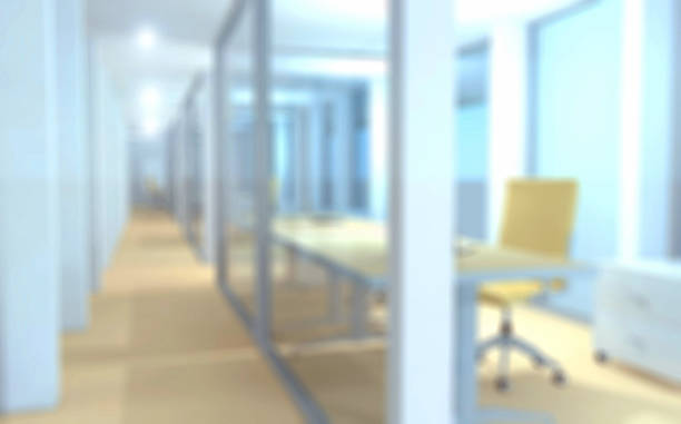 istock Defocused office corridor with glass partitions, desk with chair 513820018