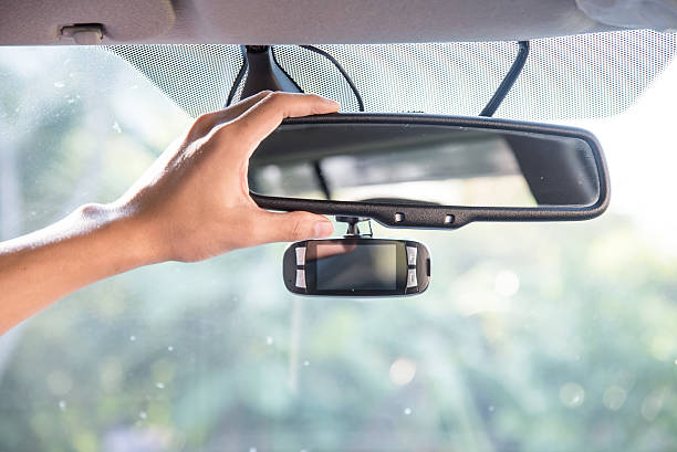 istock Adjusting The rearview Mirror of a car 513820074