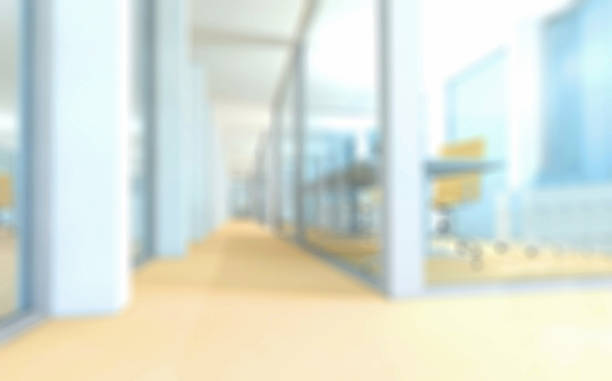 istock Defocused office corridor with glass partitions, desk with chair 513820092