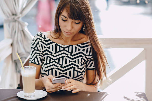 istock girl with phone 513820422