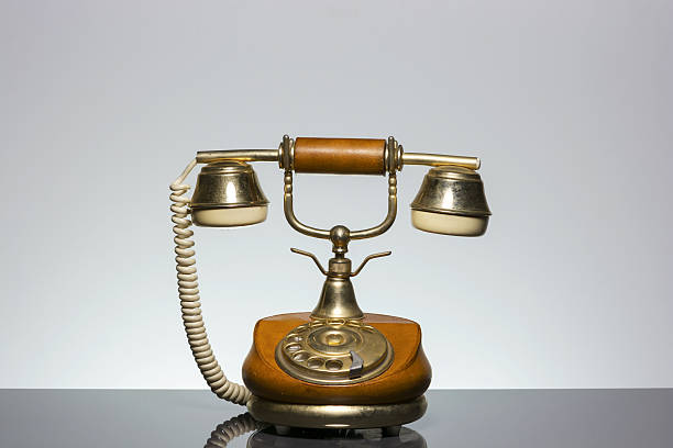 istock Elegant vintage phone on grey background 513820584