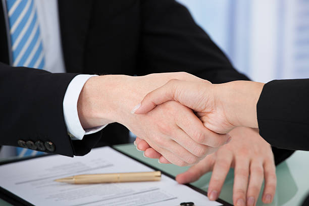 istock Cropped Image Of Business People Shaking Hands 513821381