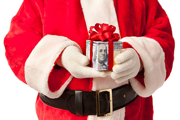 istock Santa Claus Holding Money Gift Close-up Horizontal 513821515