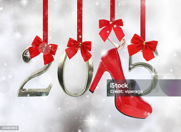 High Heel Shoe And 2015 Number Hanging On Red Ribbons Stock Photo - Download Image Now