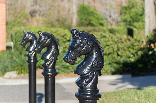 istock Black painted bollard   shaped as a horse head 513821850