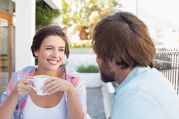 istock Happy couple enjoying coffee together 513822347