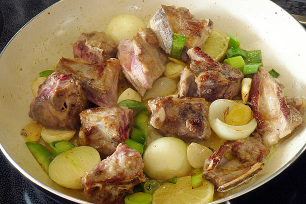 Lamb meat ragout in a ceramic pan stock photo