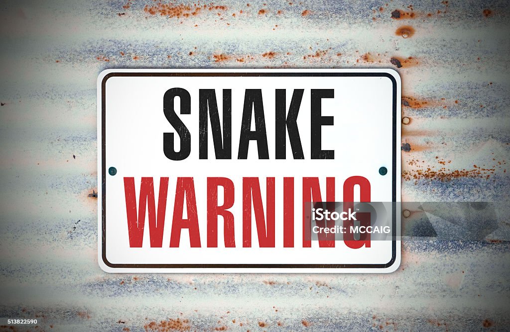 Snake Warning A sign that says "Snake Warning." Black Mamba Stock Photo