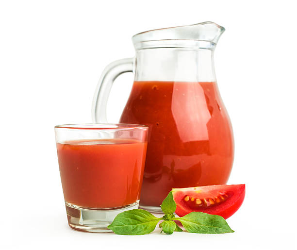 istock Tomato juice in a glass jug with basil 513824397