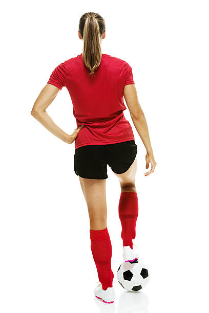 istock Rear view of soccer player standing  with ball 513827997
