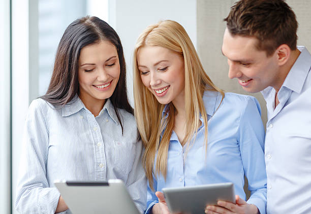 istock business team working with tablet pcs in office 513828637