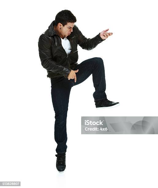Man Jumping Playing Air Guitar Stock Photo - Download Image Now - 20-24 Years, 20-29 Years, Adult