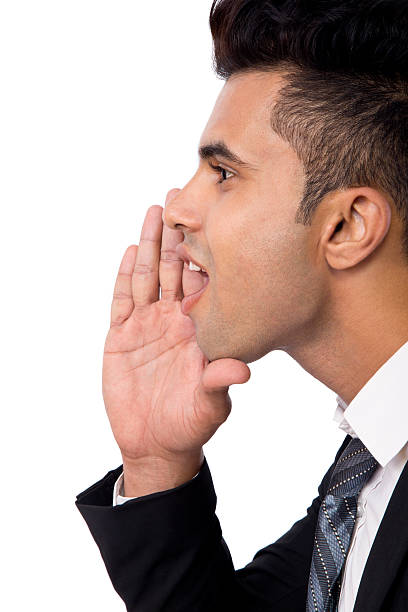 istock Close-up of a businessman whispering 513849793