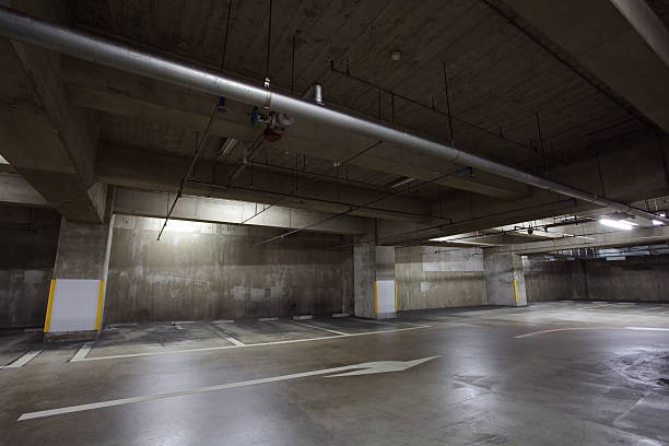 istock Parking garage underground interior, neon lights in dark 513850581
