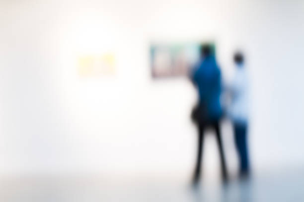 istock touist watching paintings in a museum 513851209