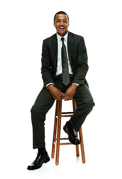 istock Cheerful businessman on stool & looking at camera 513851671