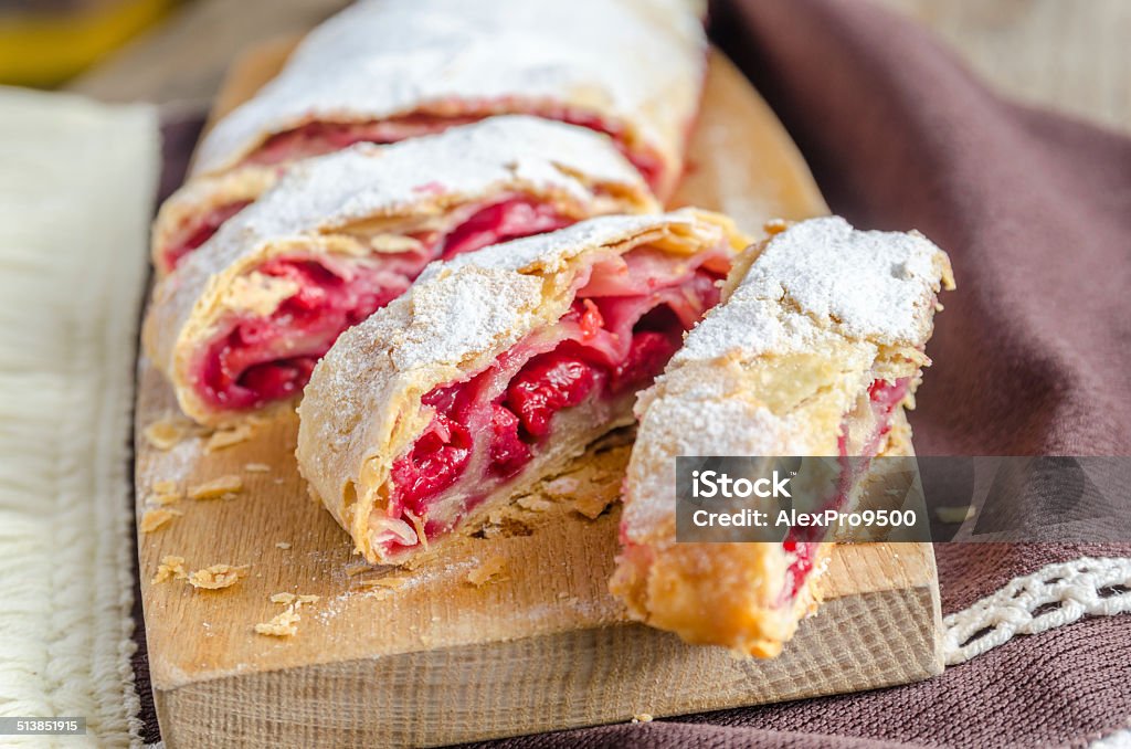 Cherry strudel on the wooden board Austrian Culture Stock Photo