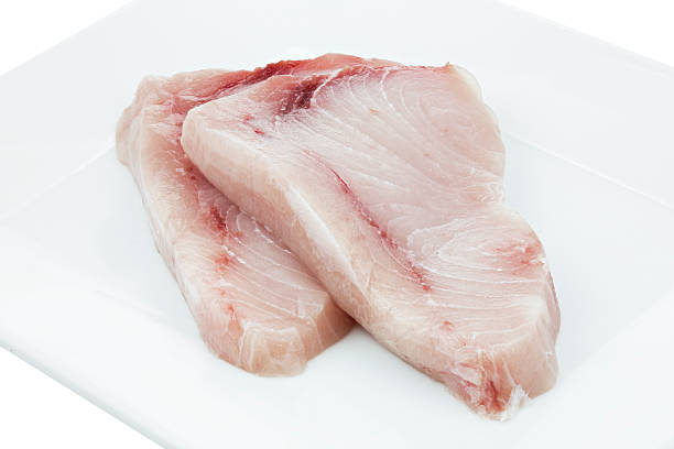 istock Two pieces of raw swordfish on a plate 513852057