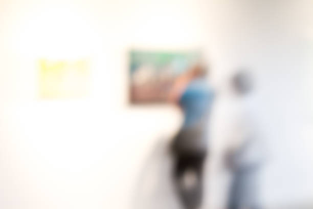 istock touist watching paintings in a museum 513852735