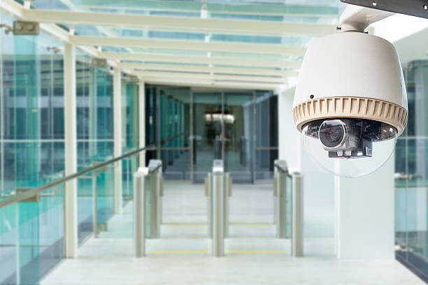 istock CCTV camera or surveillance operating in building entrance 513854907