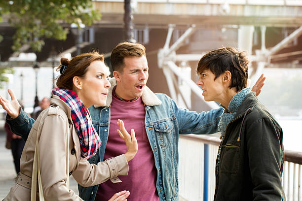 istock Street fight between three young British people 513871914
