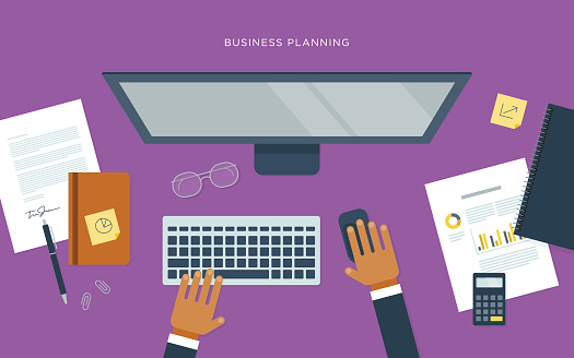 A flat vector illustration of a business planning workspace. May be used for a variety of applications, including backgrounds, web banners and graphics, presentations, posters, advertising, and printed materials.
