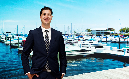 Cheerful businessman in front of lakehttp://www.twodozendesign.info/i/1.png