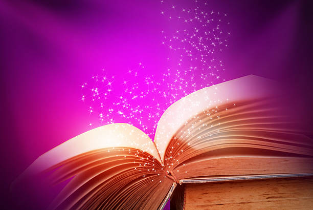 istock Abstract magic book on wooden background 513884030