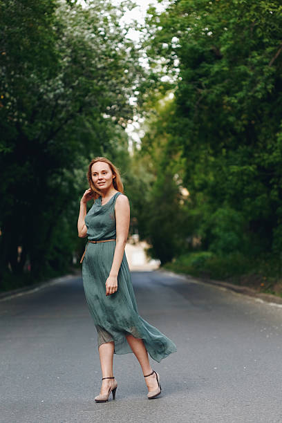 istock Young Woman Standing on the Road 513884274