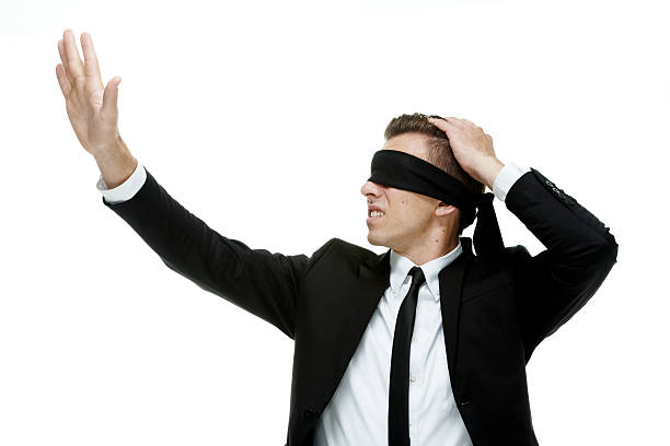 istock Businessman with blindfold on searching 513885439