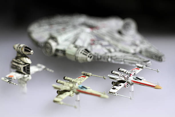 Toy Armada Vancouver, Canada - January 25, 2016: The Millenium Falcon and and other rebel starfighters from the Star Wars movie franchise. The models were made for the X-Wing minature game for Fantasy Flight Games armada stock pictures, royalty-free photos & images